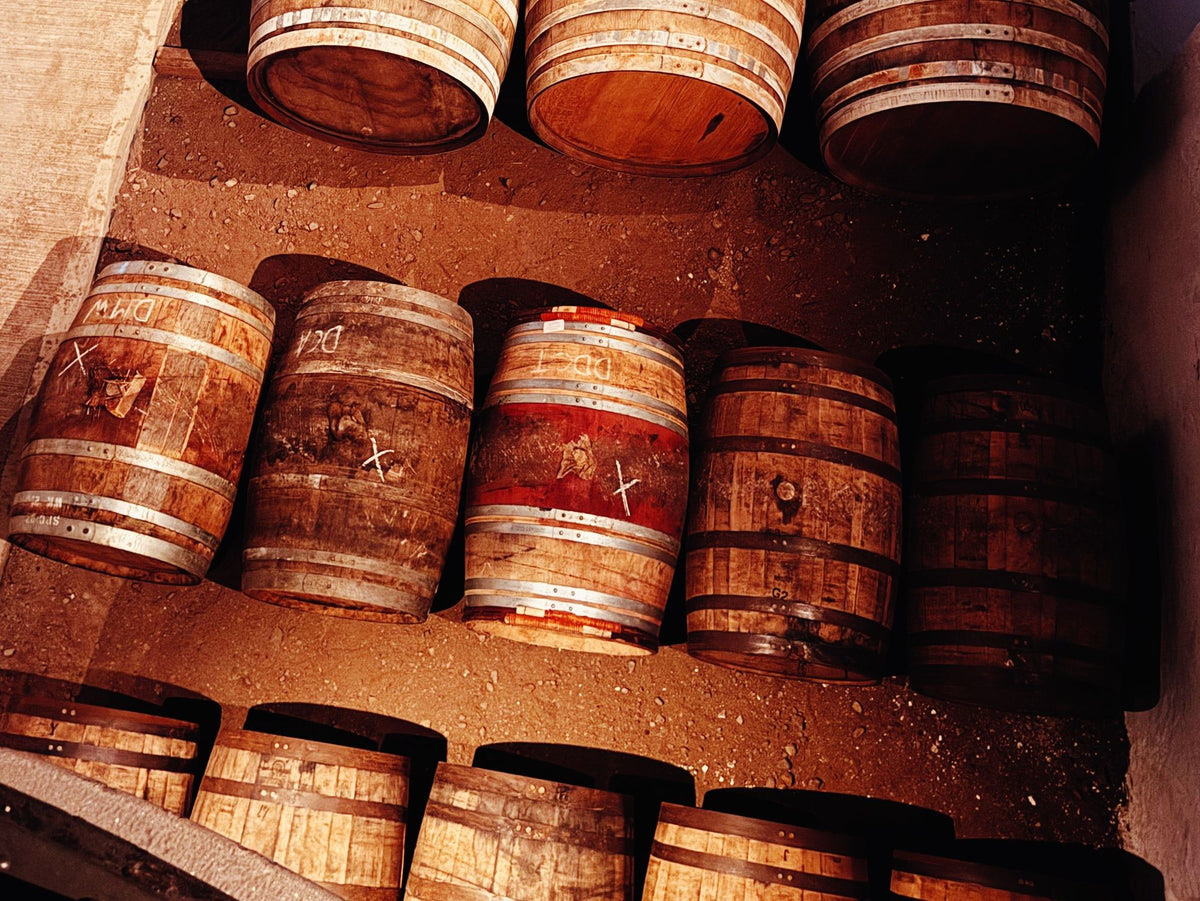 Wine casks in a warehouse, one stained from red wine