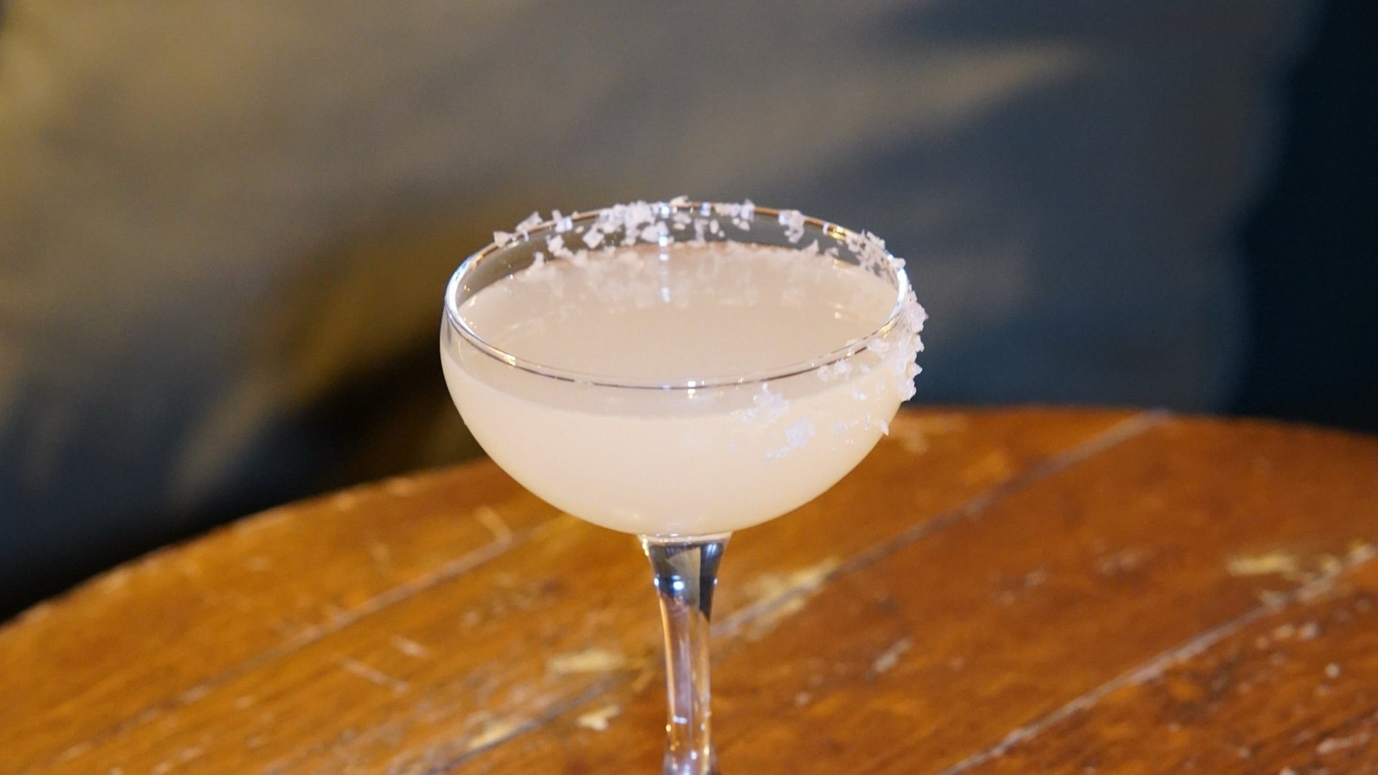 A salted-rim coupe on a wooden table in The Vault