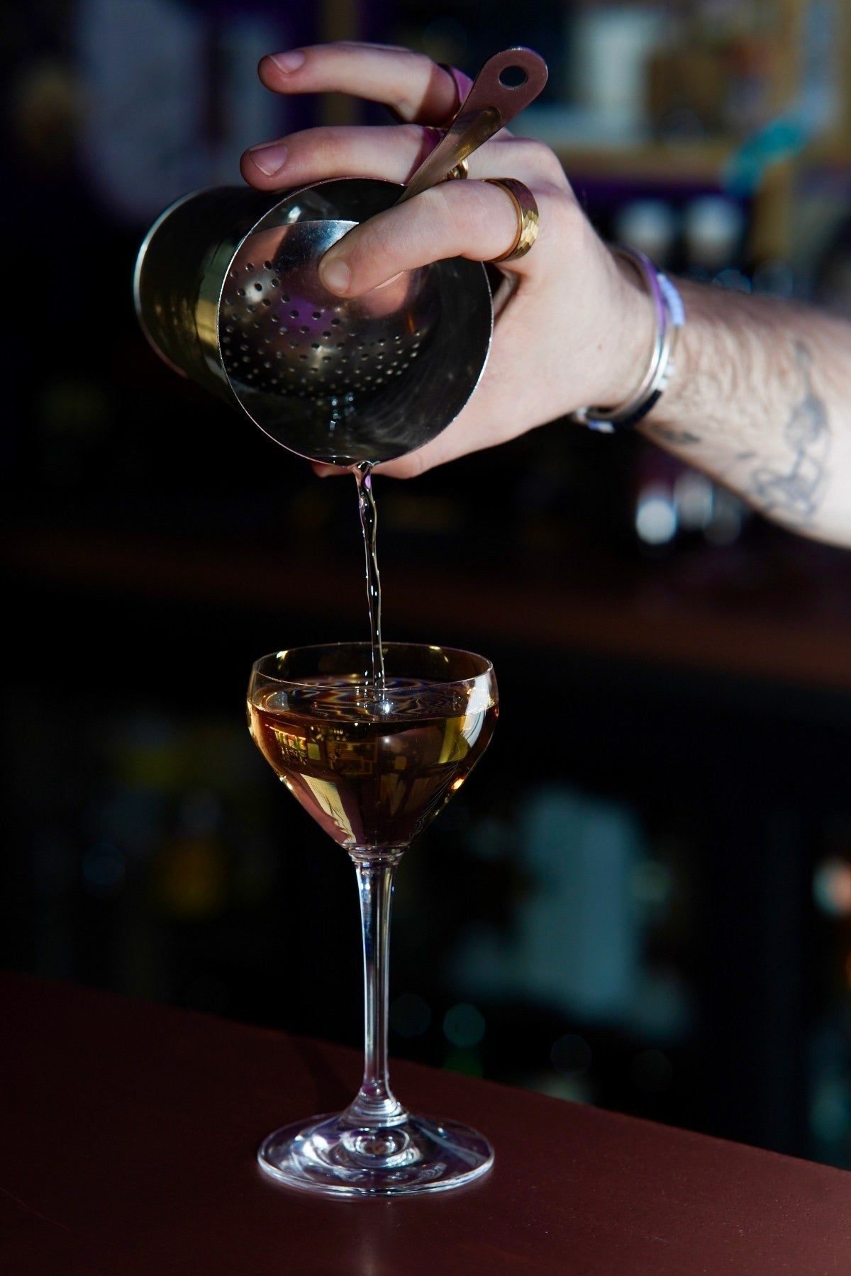 A cocktail poured from a mixing glass
