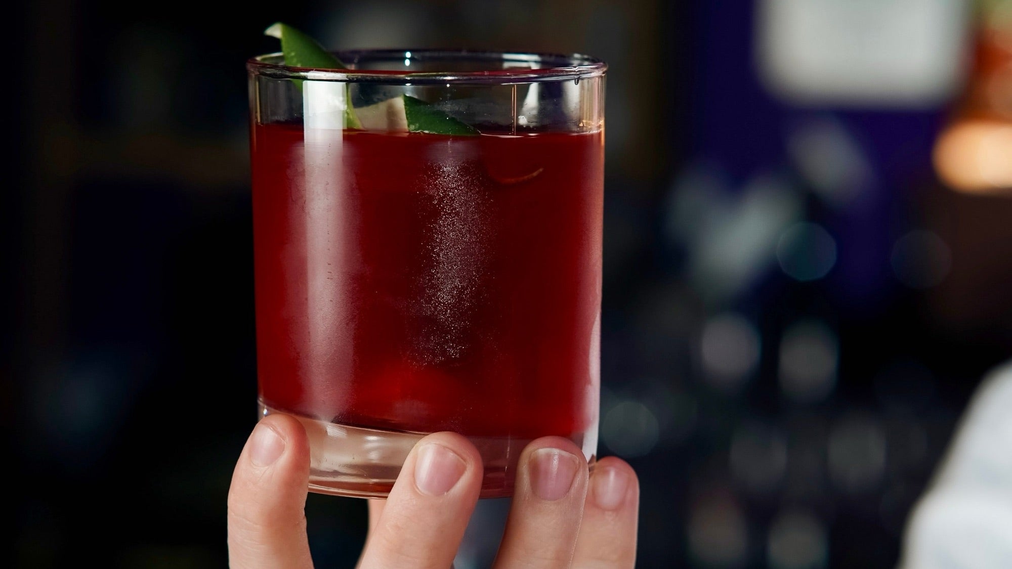 A red cocktail held at the bar in The Vault