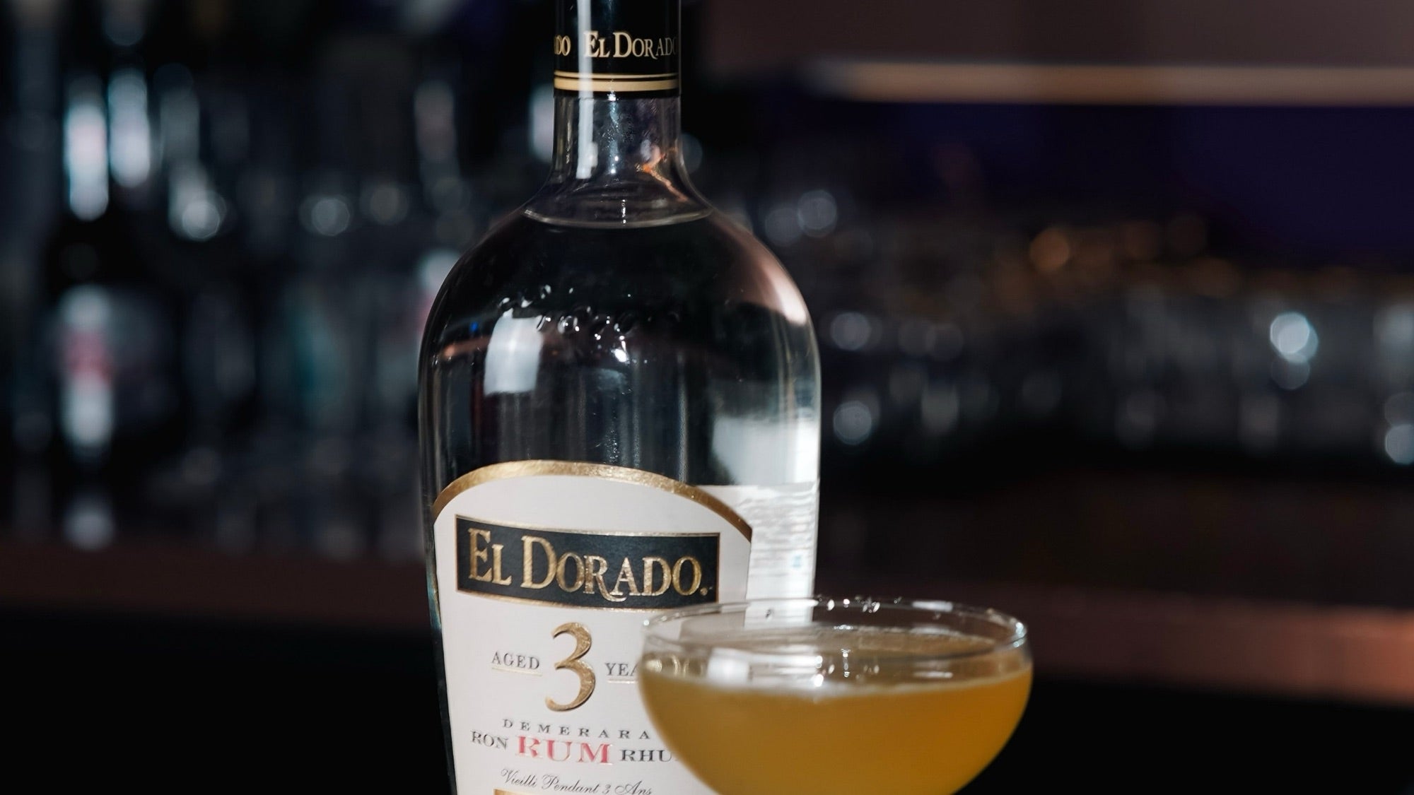 A rum cocktail beside the bottle at The Vault