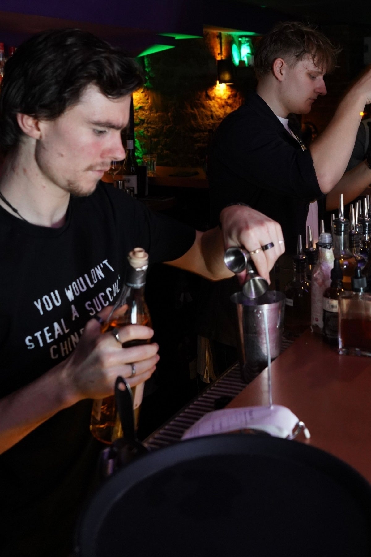 Bartenders at work in The Vault